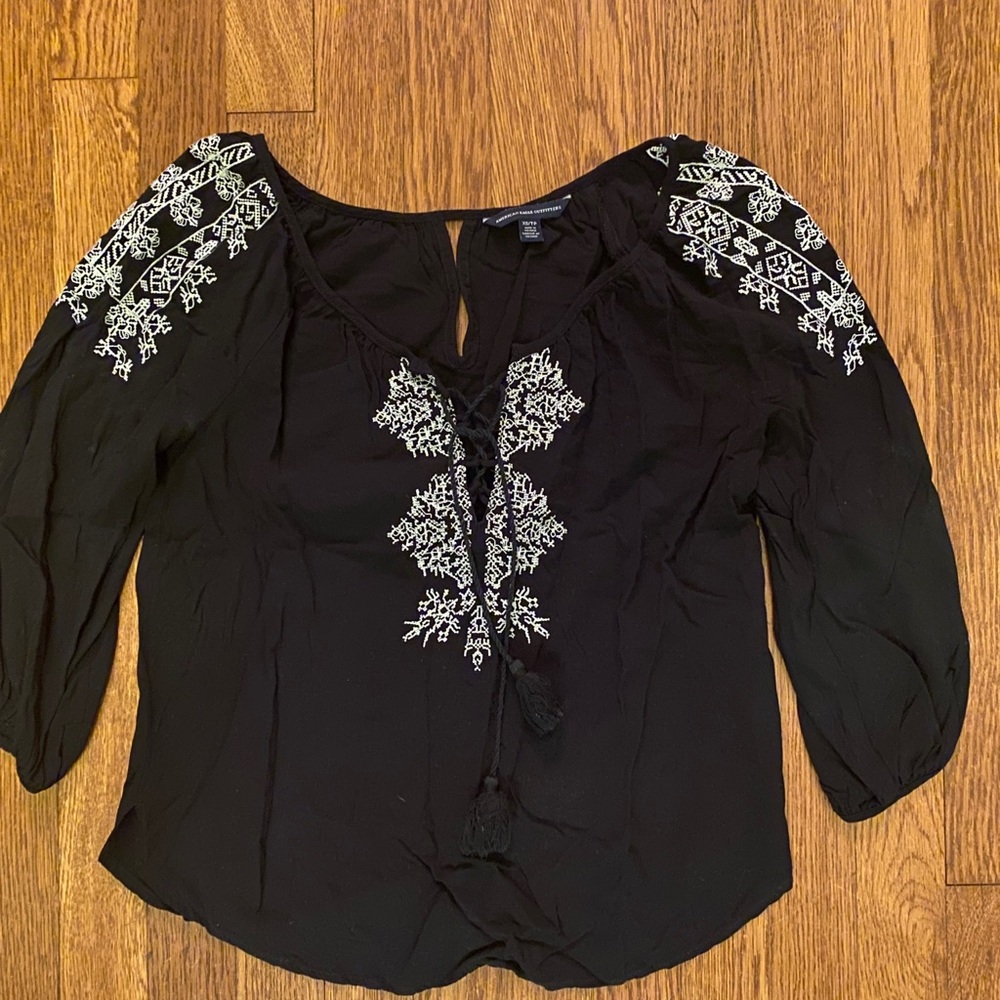 Navy blue shirt with white embroidery